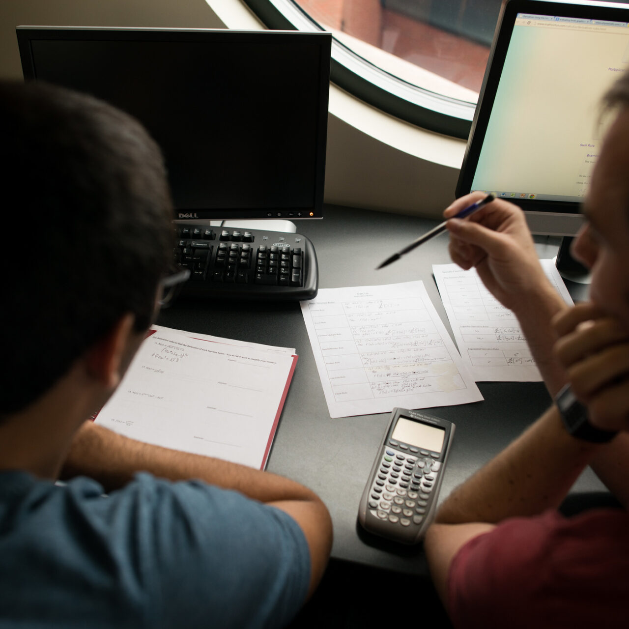 Students doing math homework together. 