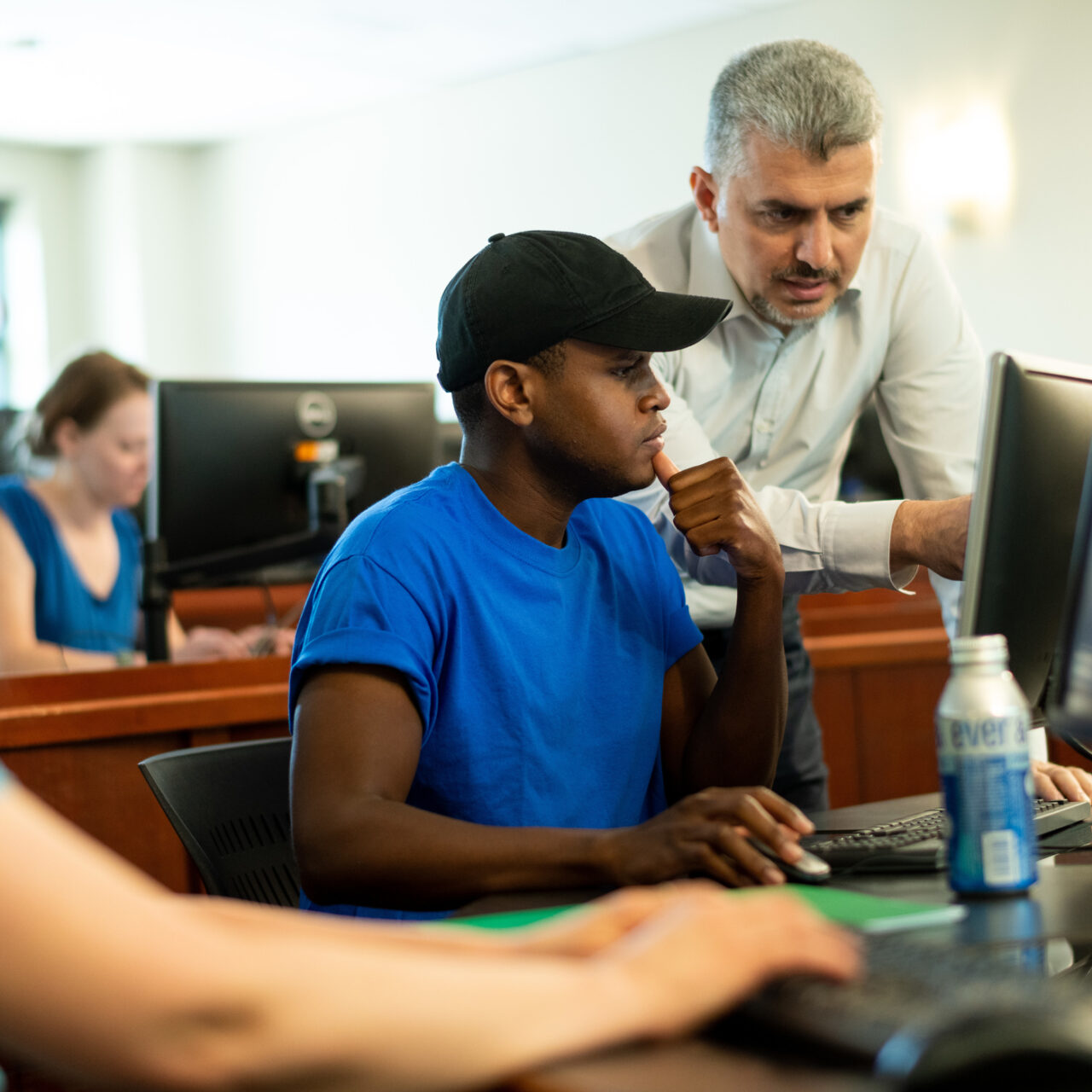 Faculty member working with student at computer