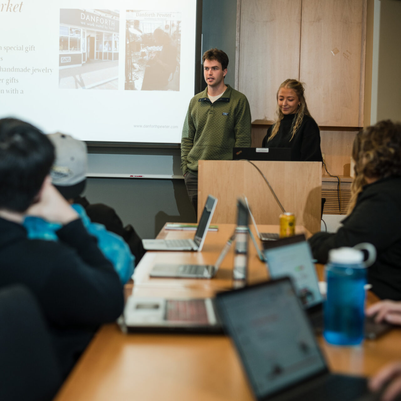 Students giving a presentation to their class. 