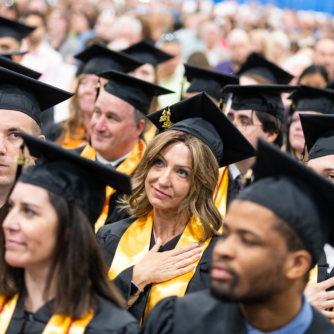 Graduating students sitting together.